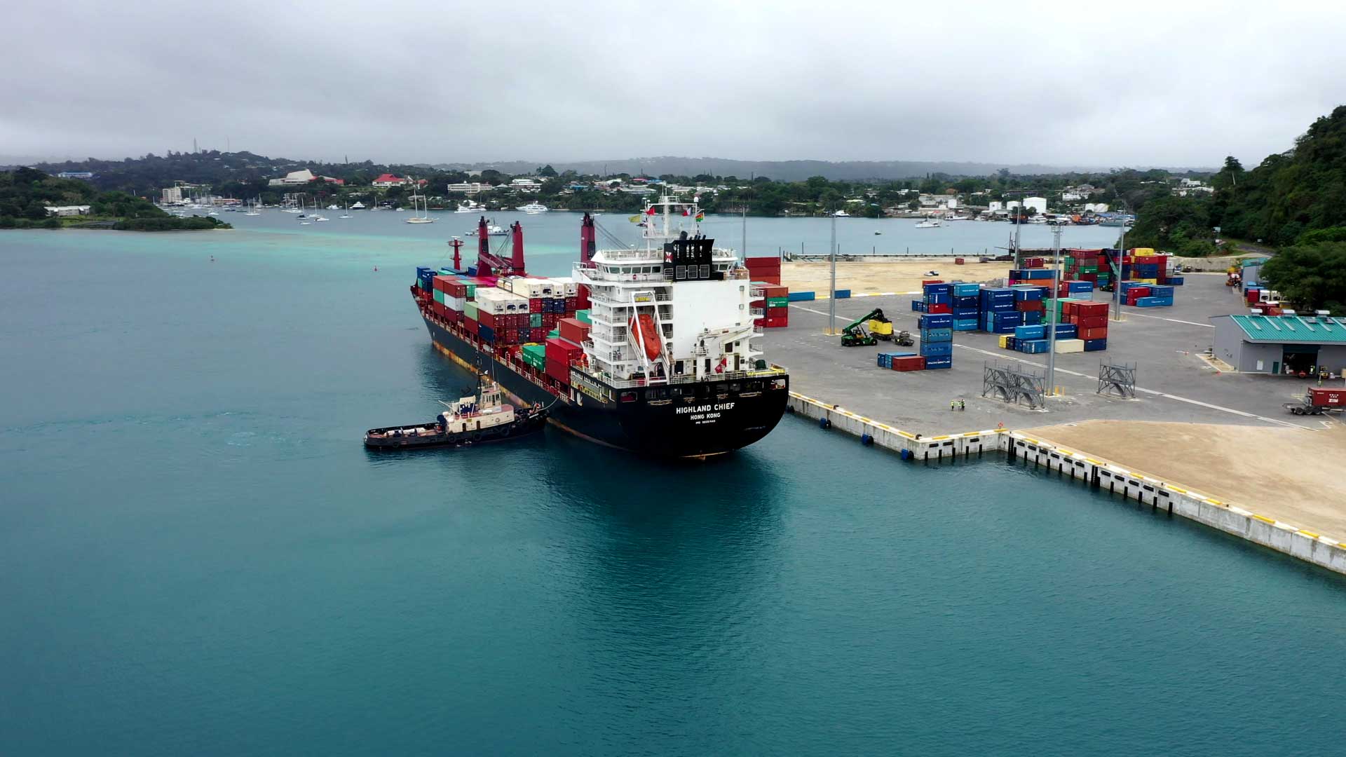 A Vanuatu tugboat assisting a barge to safely come to port